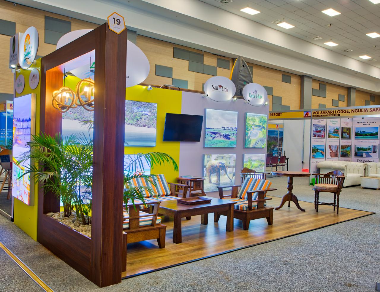 Yellow exhibition booth with seating