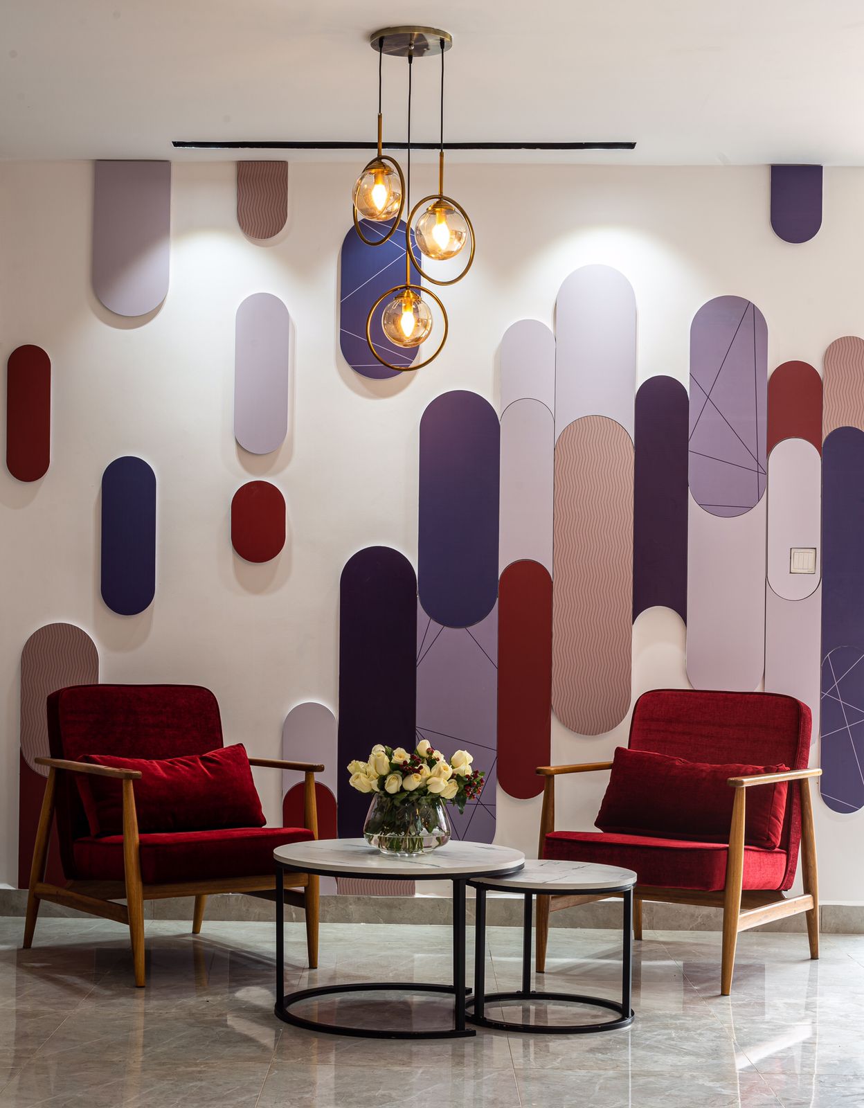 Decorative lounge wall with red chairs